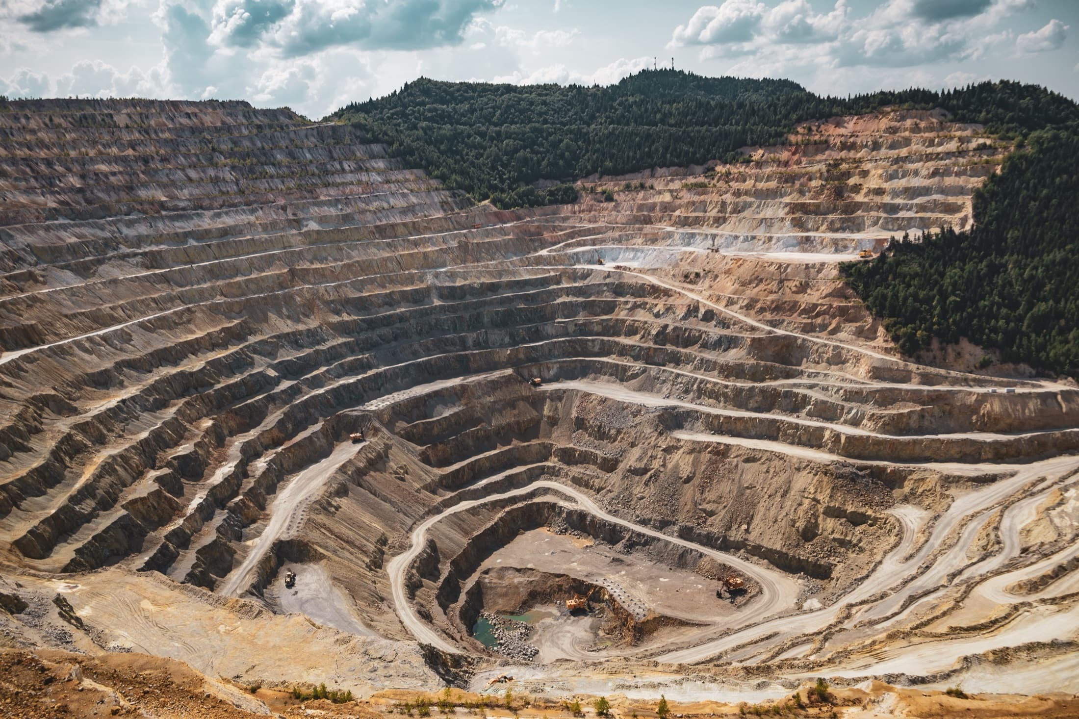 Aerial view of a terraced open-pit mine